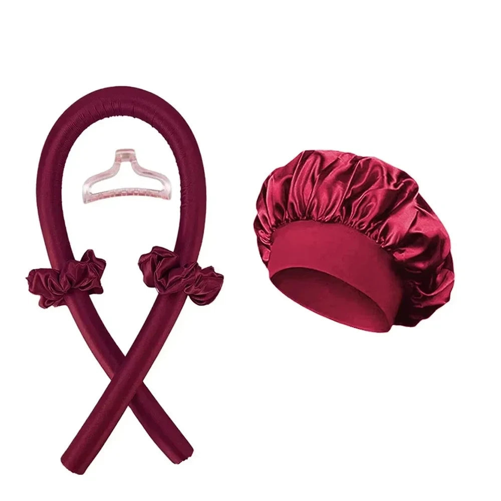 Seraphic heatless hair curling set in deep burgundy satin with a matching bonnet, curling rod, and hair clip.